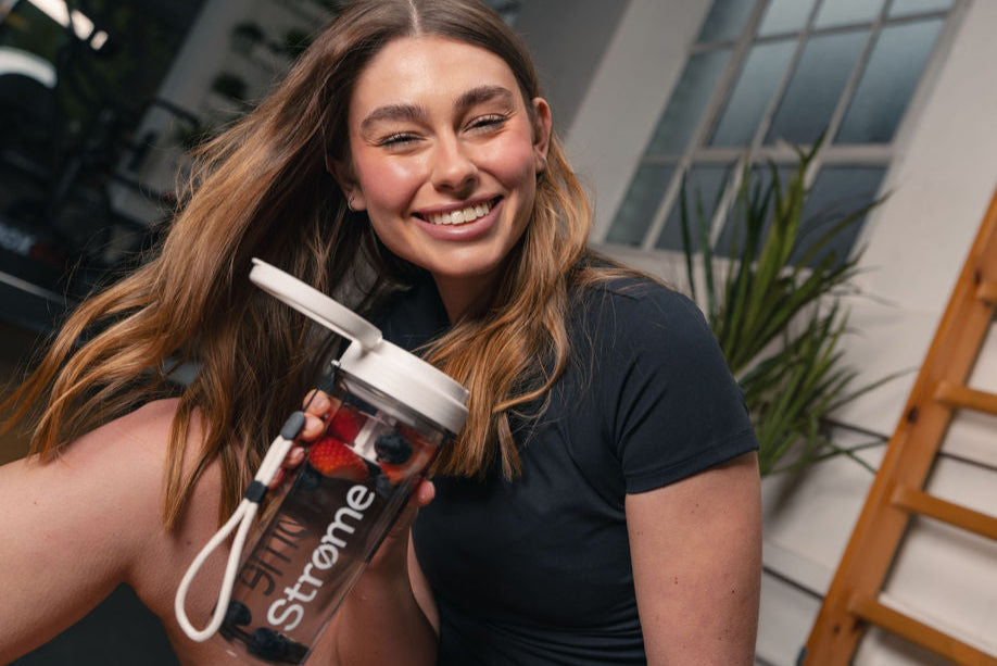 Female Model Smiling With Strome Fruit Drink